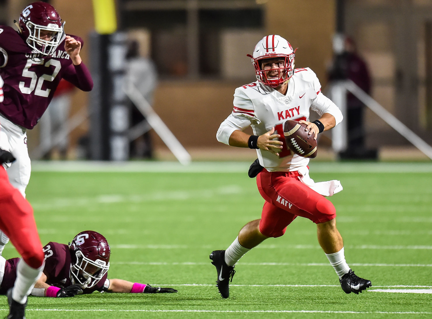 Senior Bronson McClelland returns to run the Katy Tigers’ offense as a top-25 quarterback recruit according to “Dave Campbell’s Texas Football Magazine.” Pictured is McClelland escaping the pocket during a conference game between Katy and the Cinco Ranch Cougars at Legacy Stadium Oct. 25, 2019.